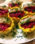 Картофельные тарталетки с селедкой в мини шубке